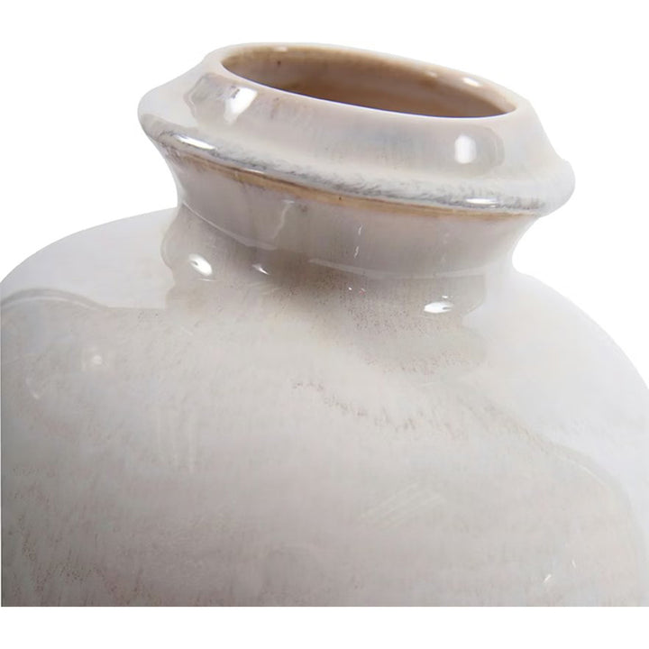 Close-up of a ceramic vase with a smooth, glossy finish on a white background