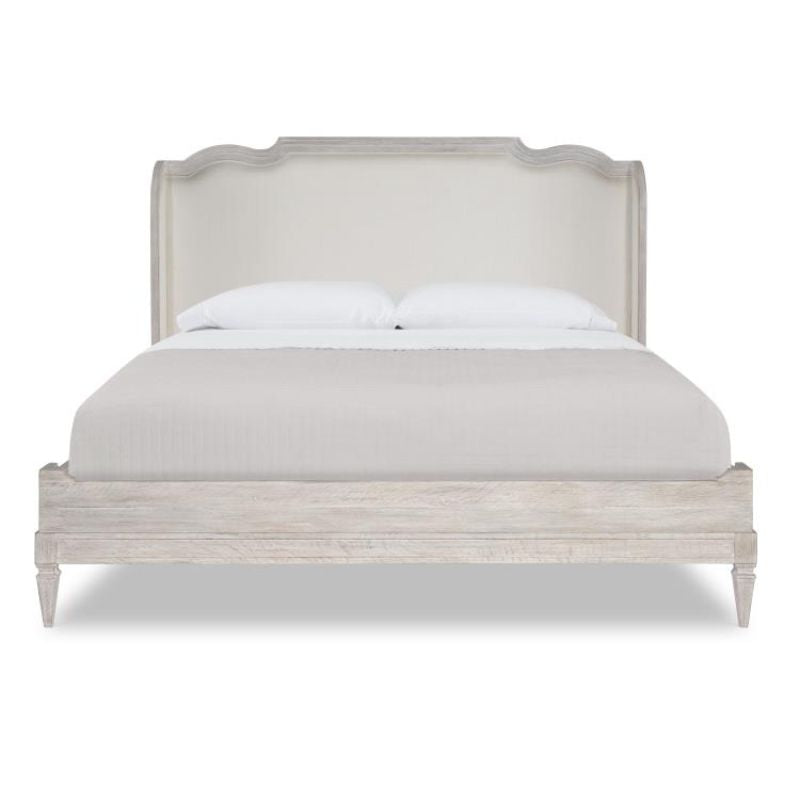 Bed with linen bedding on a white background