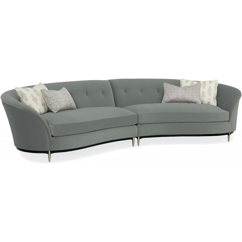 Gray sectional sofa with decorative pillows on a white background